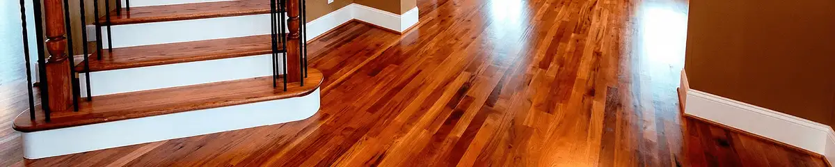 Base floor of a staircase with professionally restored wood flooring in Hollywood FL