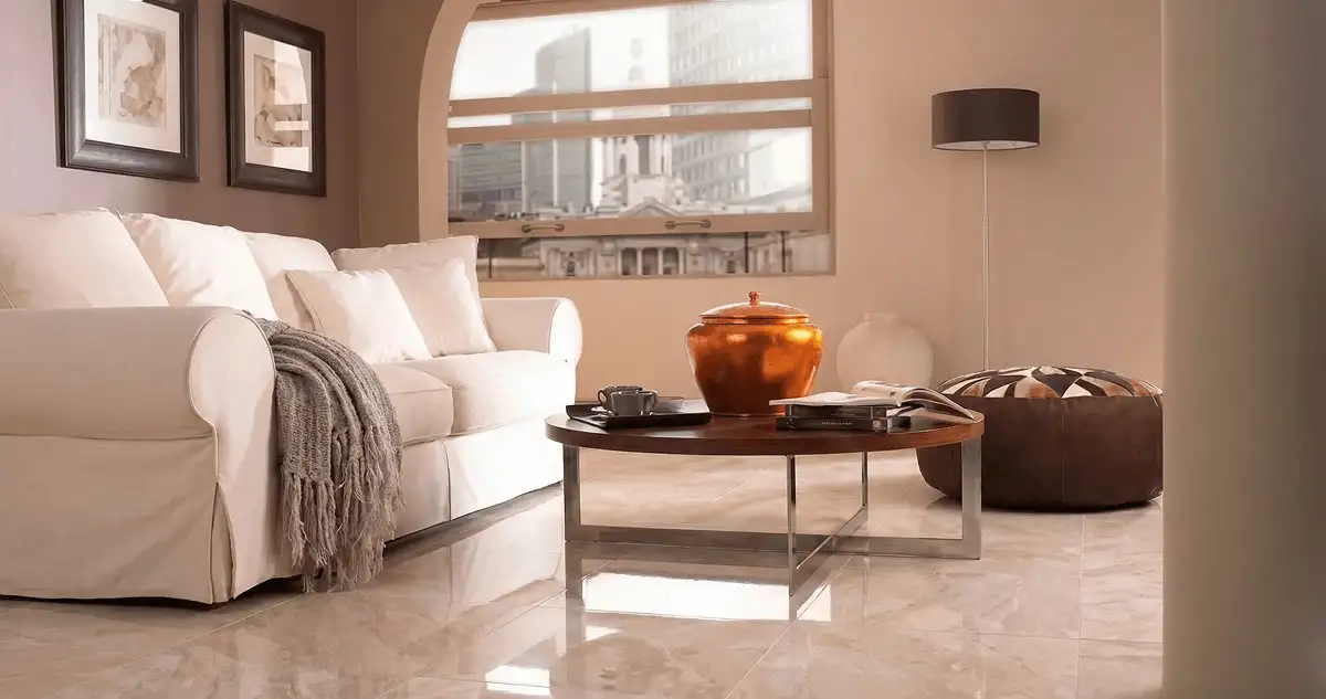 Modern living room with professionally installed marble flooring, a beige sofa, coffee table in Hollywood, FL