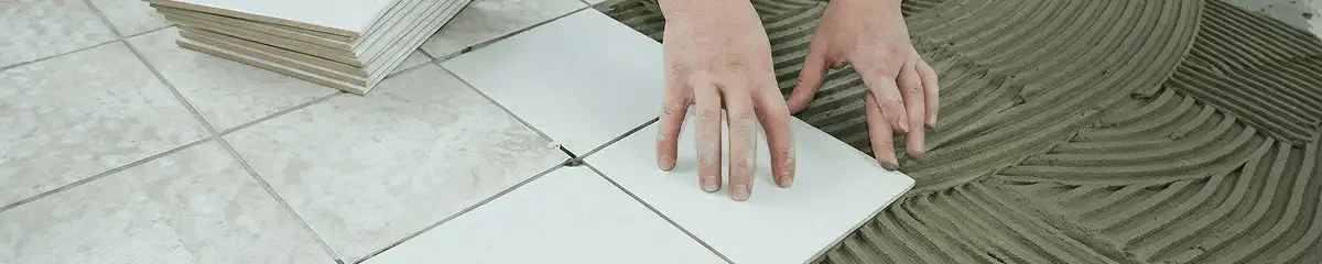 Professional installing white tile floors in Hollywood, FL
