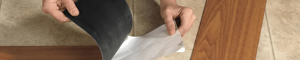 A professional installing vinyl flooring in Hollywood, FL