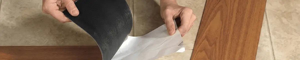 A professional installing vinyl flooring in Hollywood, FL