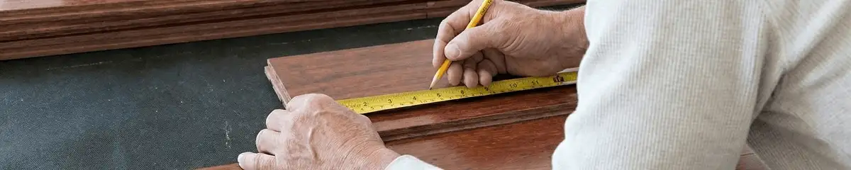A professional installing wood flooring in Hollywood, FL